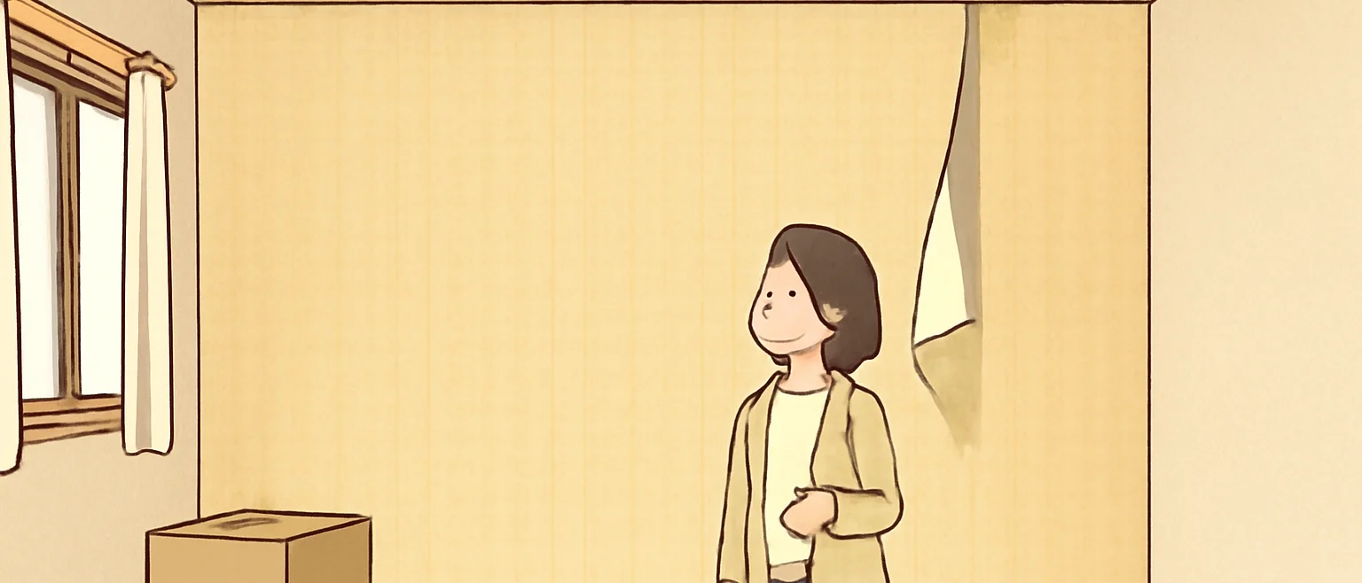 荷物が片付いた部屋で、壁紙の上のほうが縦にめくれて垂れ下がっているのを見上げる女性