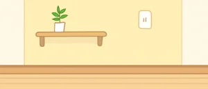 白い壁の部屋で、奥の1面だけが淡いイエローの壁紙になっている様子